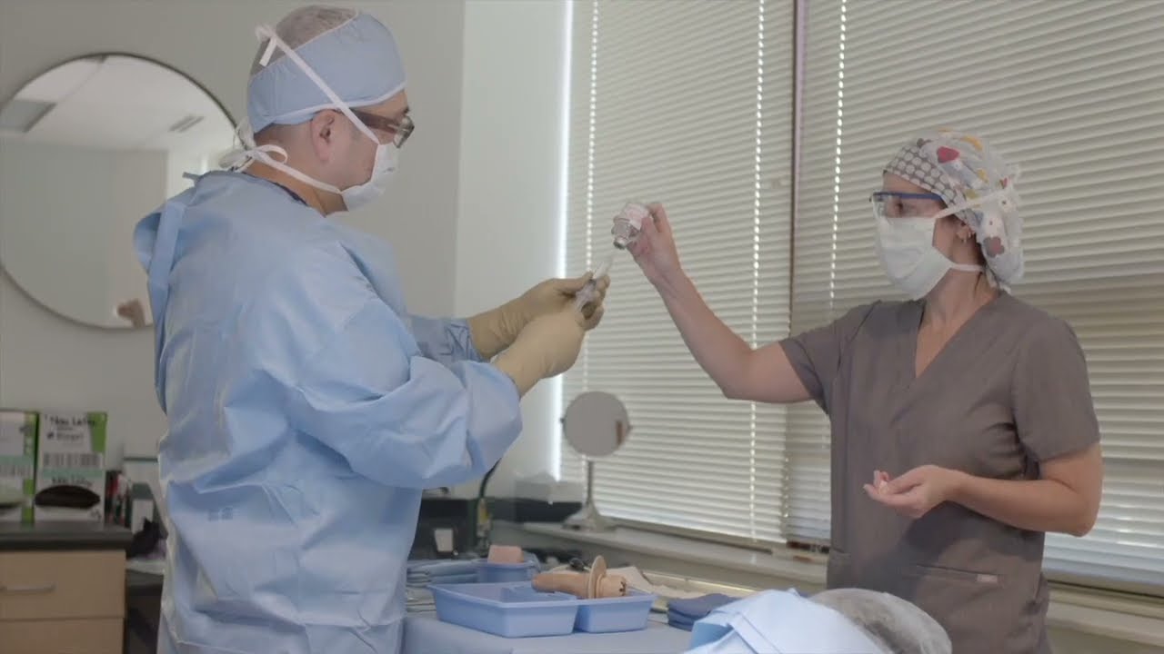 Dr. Kwak preparing injection during surgery